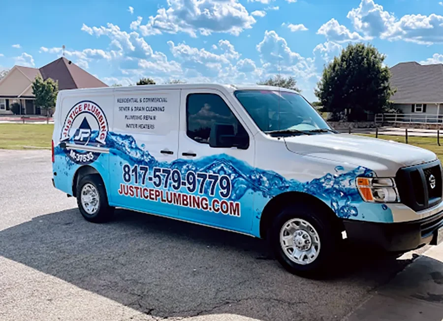 Justice Plumbing service van parked in Granbury, TX neighborhood, showcasing residential plumbing services