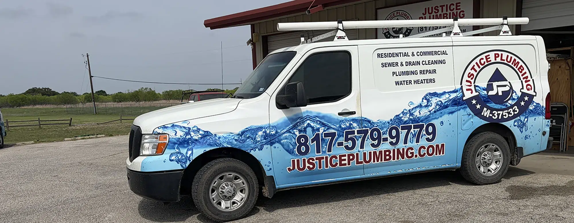 Justice Plumbing service van parked in Granbury, TX neighborhood, showcasing residential and commercial plumbing repair and drain cleaning services.