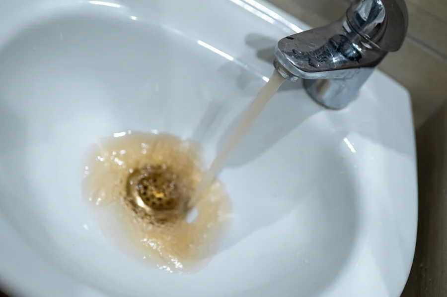 Discolored water coming from faucet showing need for repiping service